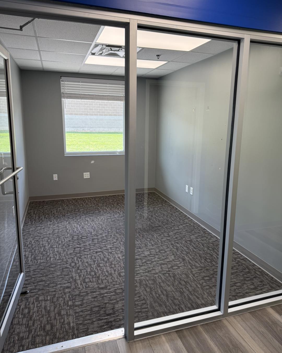 Spotless modern bedroom with natural light, freshly made bed, and clean floors in Cary NC home