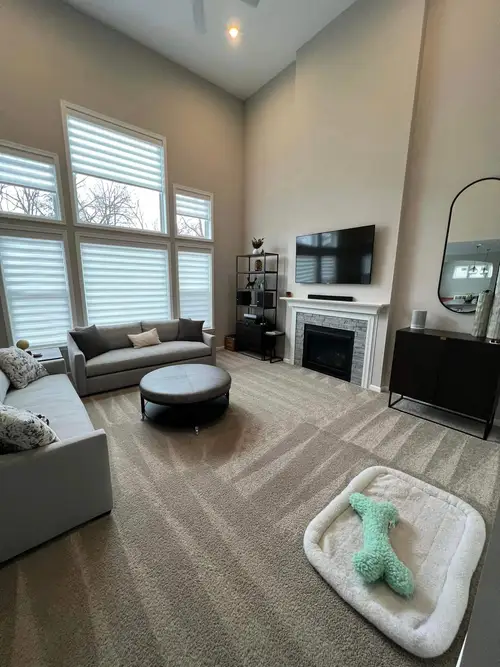 Clean modern kitchen with white cabinetry, wood accents, and natural light in Raleigh NC